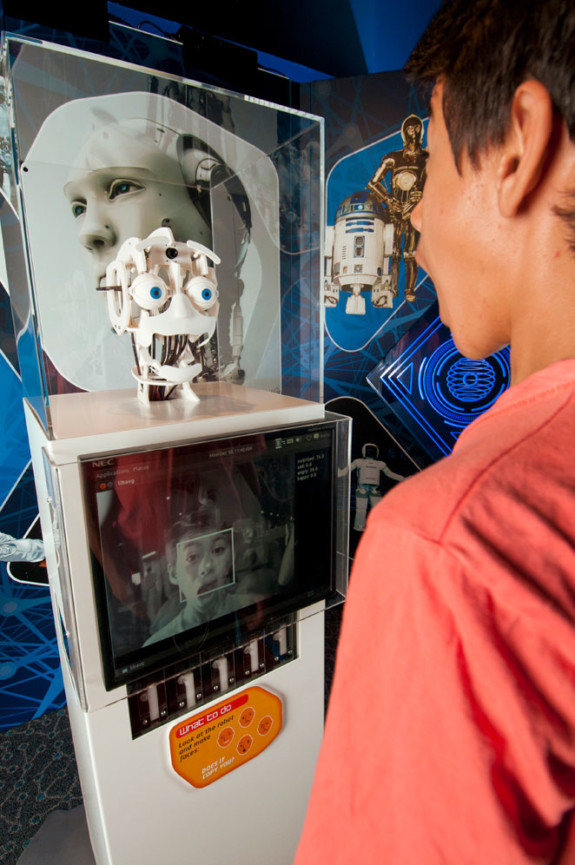 A robot face mimicking a young boys facial expression in the Science Fiction Science Future Exhibition.