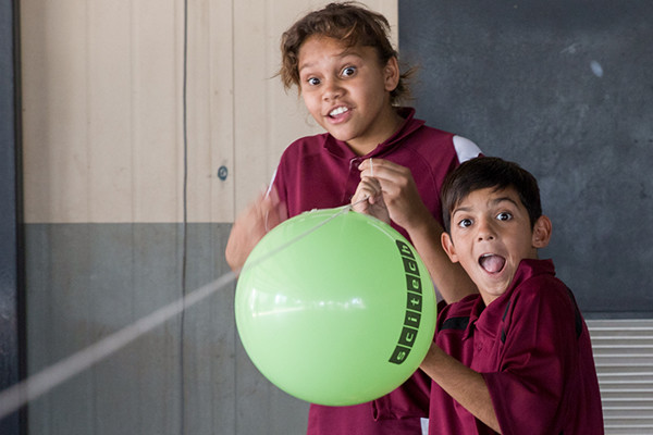 Two students from the Aboriginal Education Program holding a Scitech branded balloon