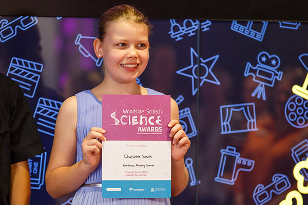 Young female teenage accepting a Woodside sponsored Scitech Science award.