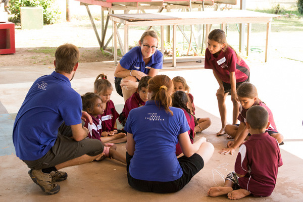 Science presenters using the DIY biological science kit with kids in the Aboriginal Education Program.