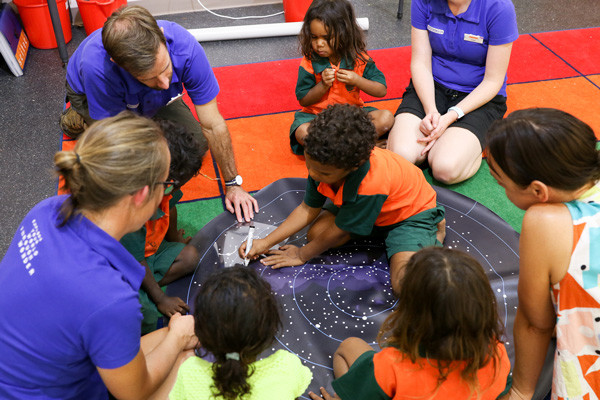 Science presenters using the DIY earth and space science kit with kids in the Aboriginal Education Program.