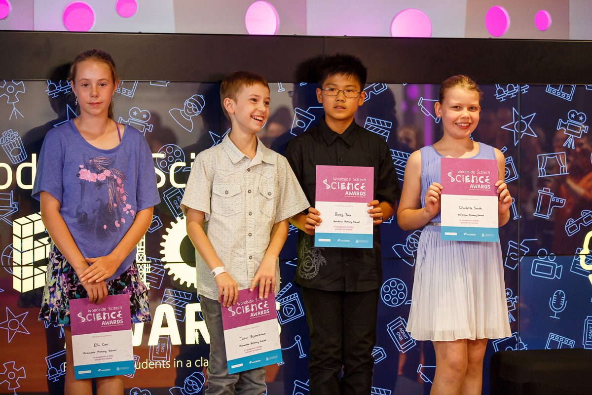 A group of students holding up their science awards.