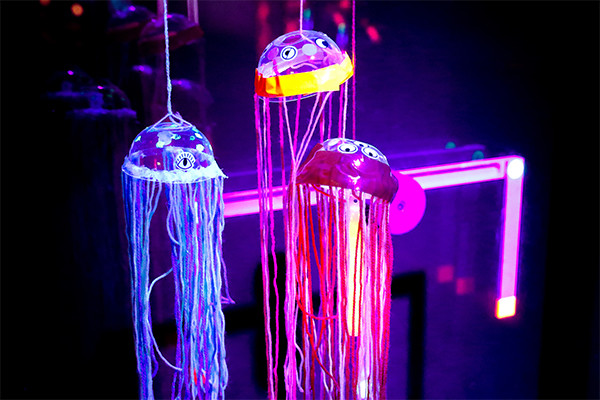 Jellyfish structures made out of glowing materials.