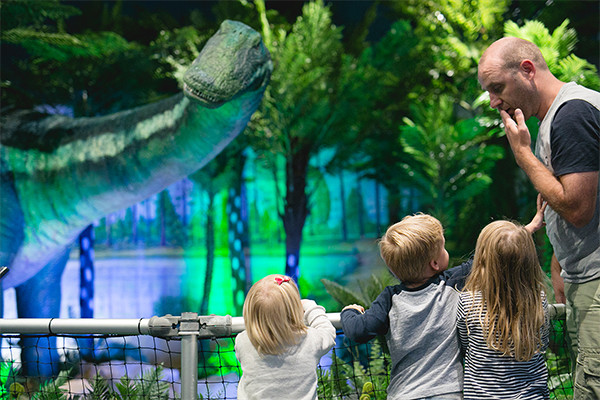 Kids looking at dinosaur