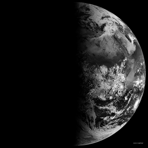 A black and white image of Earth at Equinox ("Equal Night") taken from space by NASA's Earth as seen by Meteosat-9