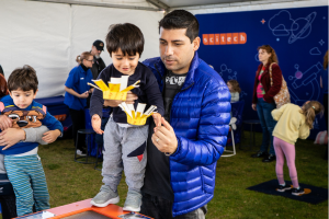 Father and son interacting with a Scitech exhibit