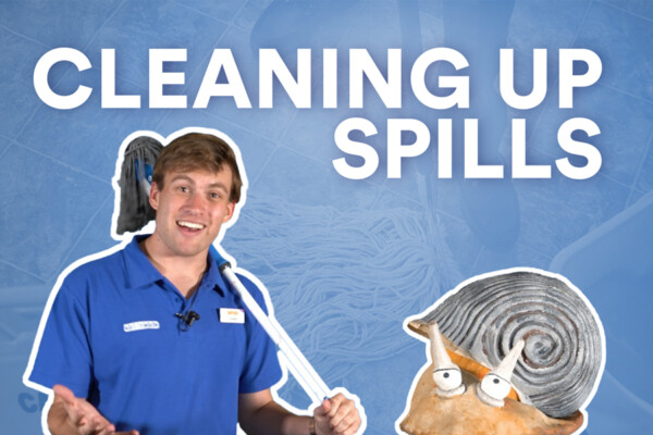 Cleaning up spills. Steven holding a mop.
