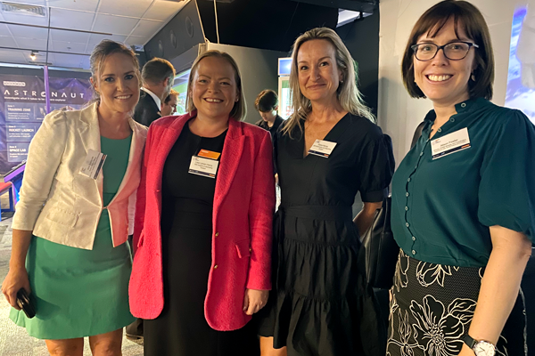Four ladies posing for a photo together at a WA STEM Connect event