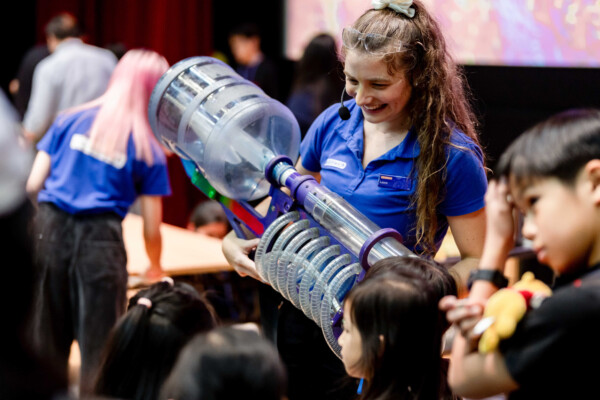 Science communicator Laura McSkimming shows children a plasma popper